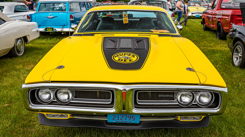 A front-end view of a yellow 1970 Dodge Charger Super Bee.