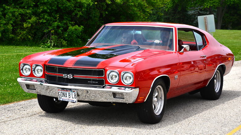 A red 1970 Chevrolet Chevelle SS 454 driving