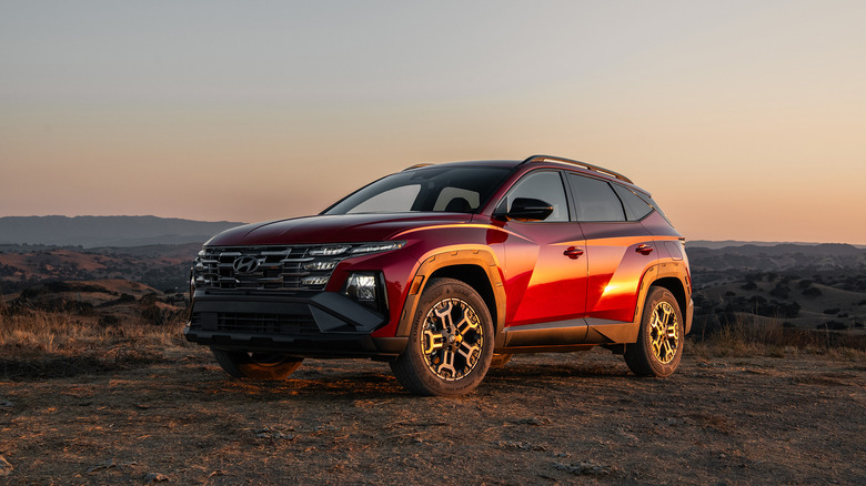 A side on shot of a red 2026 Hyundai Tucson XRT parked
