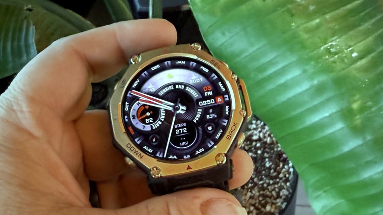 A man holding a T-Rex 3 Pro watch