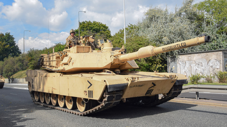 M1 Abrams driving on an urban roadway