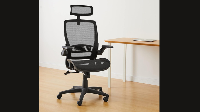 Mesh office chair in front of desk