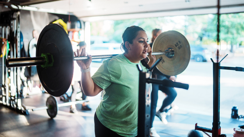 Woman working out in a garage