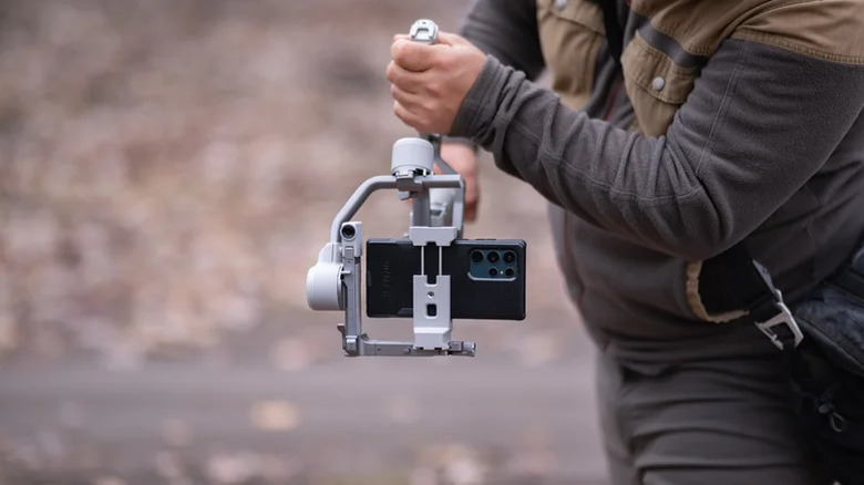 Person using the DJI RS 4 Mini gimbal