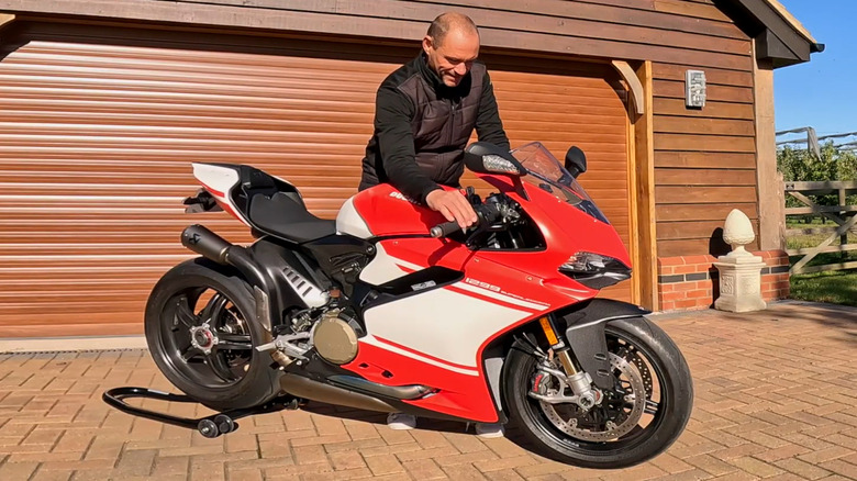 Rider blipping the throttle of a Ducati 1299 Superleggera