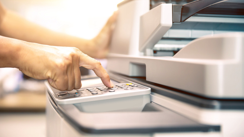 Person using a fax machine