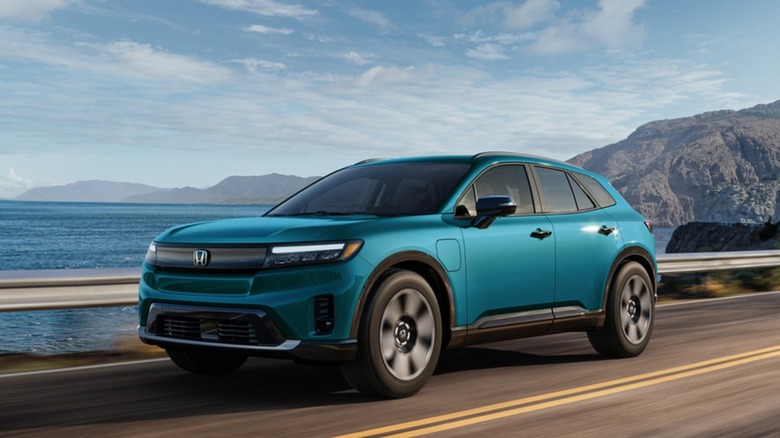the Honda Prologue driving on a highway.