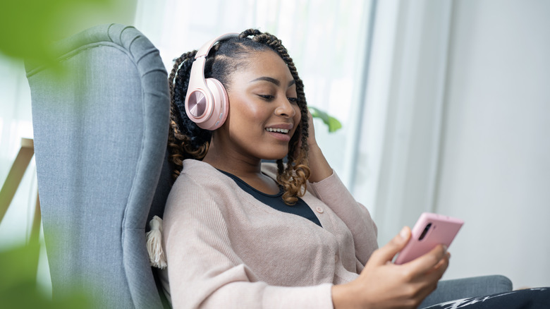 Person wearing headphones on a phone call
