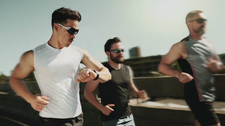 Runner checking their fitness tracker