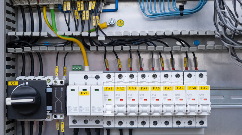 Electrical switchboard distribution box with different colored wires and circuit breakers
