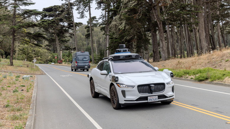 waymo driving through quiet street