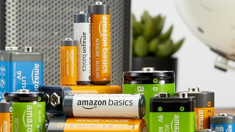 Amazon Basics batteries stacked on a table.
