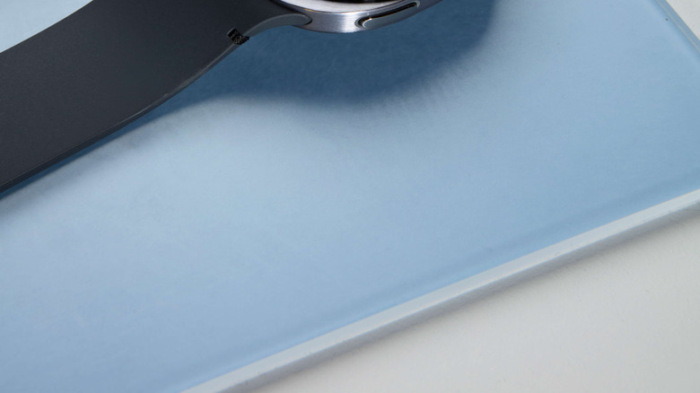 Samsung Galaxy Watch8 posed on textured surface