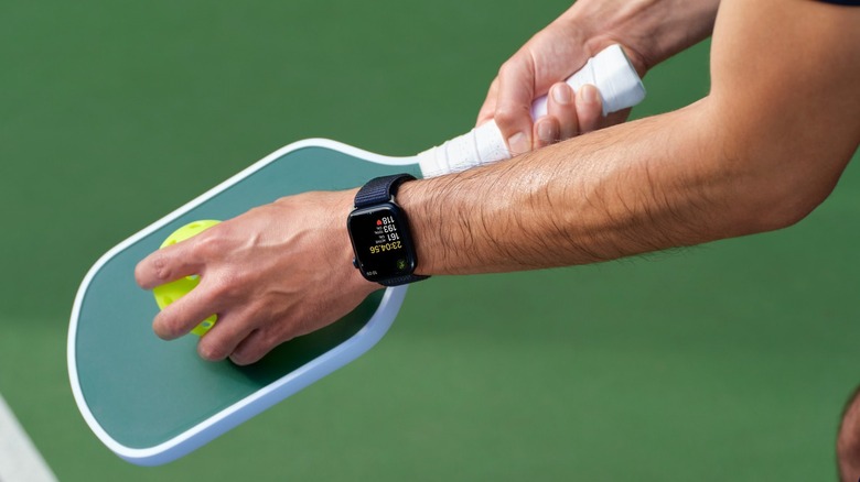 Man wearing Apple Watch while playing pickleball