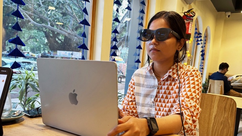 Person wearing smart glasses.