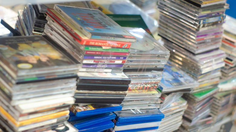 Piles of used CDs in stacks