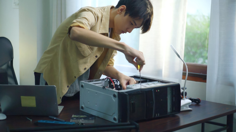 Old computer tower being taken apart