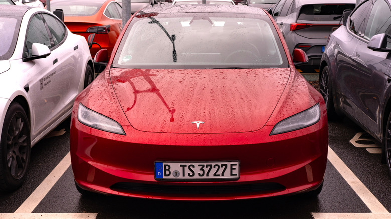 Tesla Model 3 parked in a space