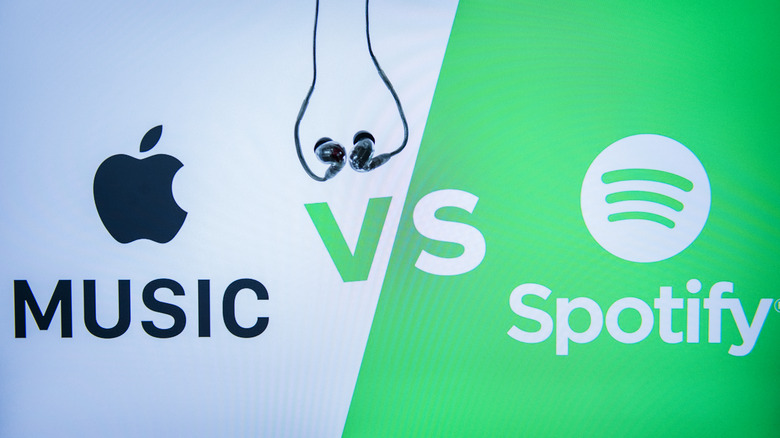 Apple Music vs Spotify graphic with company logos