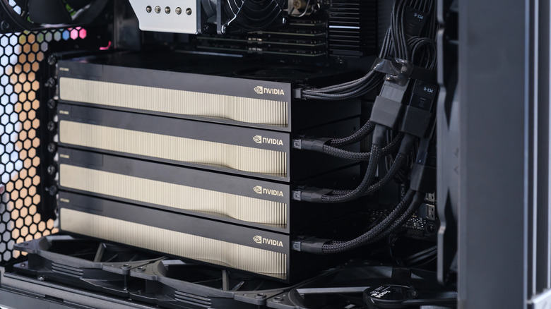 Four Nvidia graphics cards connected inside computer
