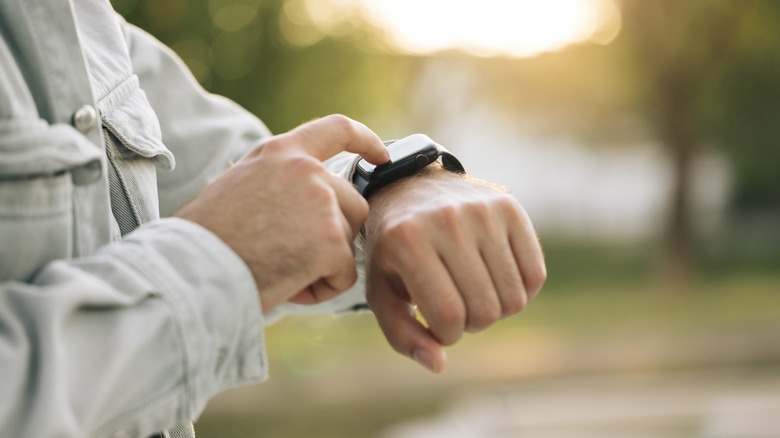Person using an Apple Watch in Nature Park