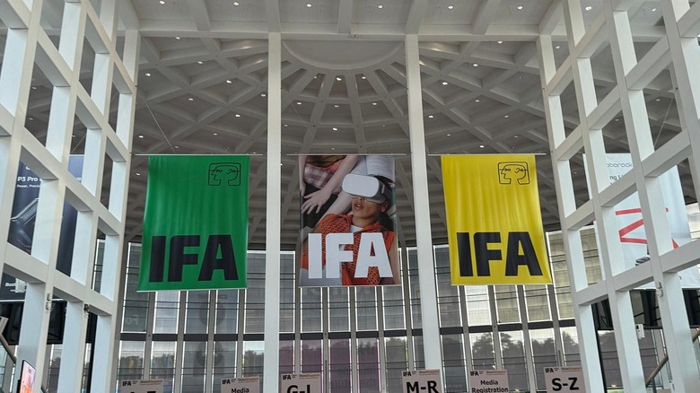 Green and yellow flags for IFA 2025 hanging in hall