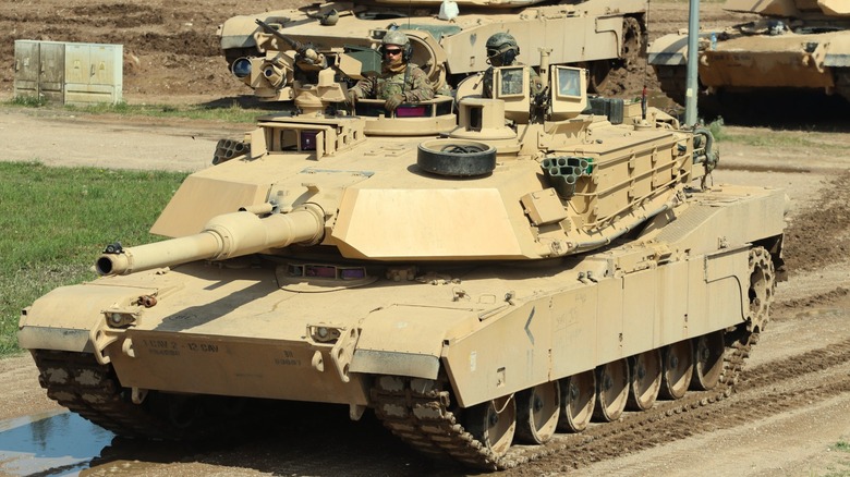 An Army M1A2 SEP operated by several personnel