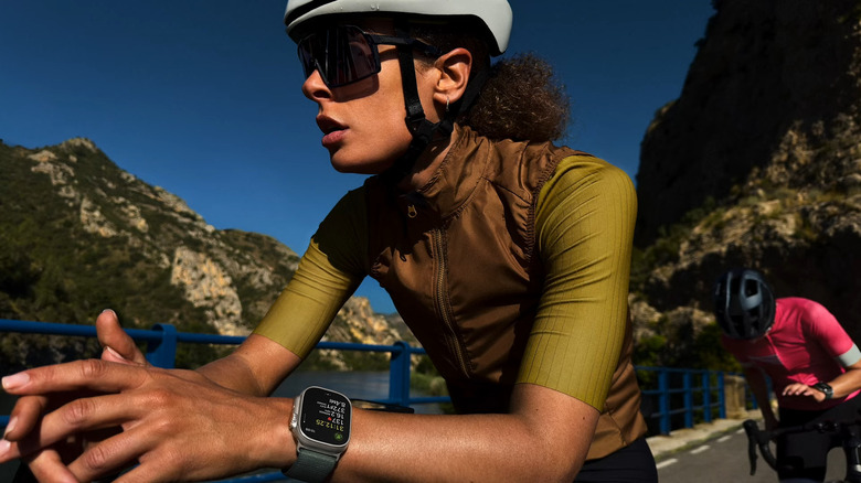 Woman biking while wearing Apple Watch Ultra 3