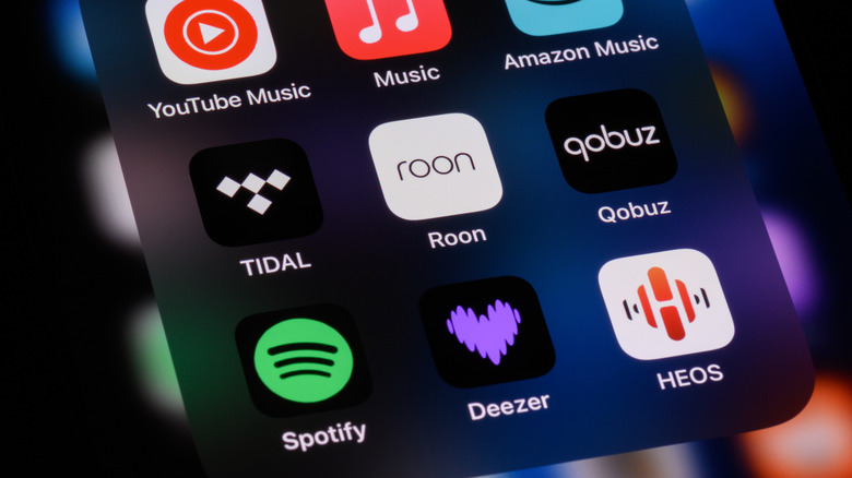 Music streaming apps on an iPhone home screen