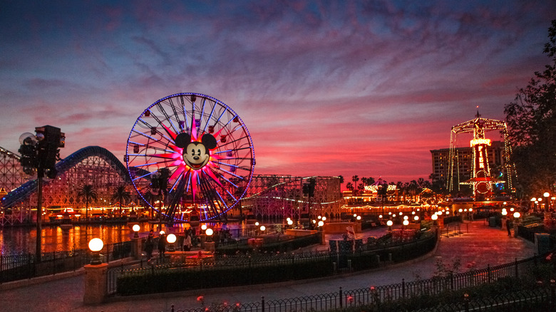 A wide angle shot of Disneyland California at sunset