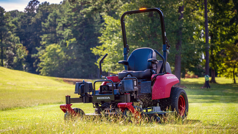 Red Honda ProZision Autonomous ZTR lawnmower on open field