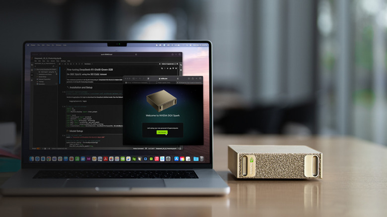 An Nvidia DGX computer sitting next to a laptop