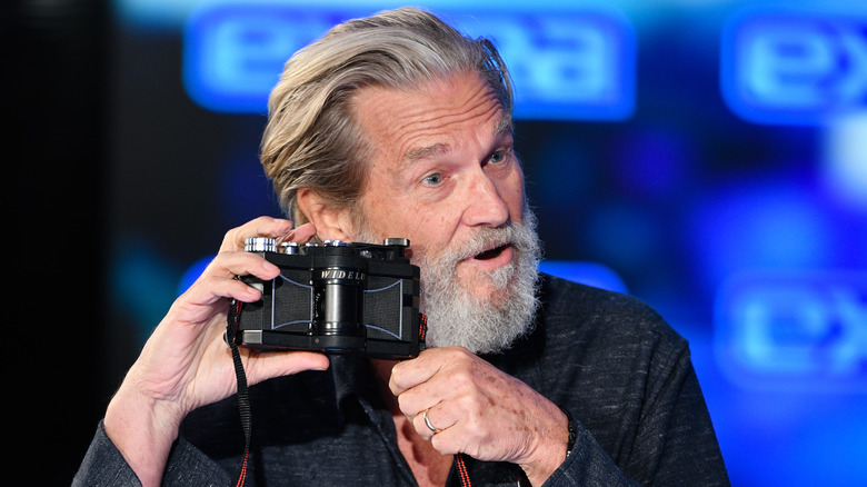 Jeff Bridges holding a new Widelux camera prototype