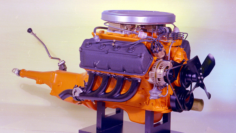 HEMI engine on stand with purple valve covers and manual transmission