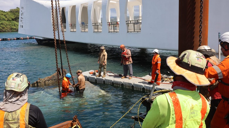 Sailors prepare to remove concrete from USS Arizona memorial