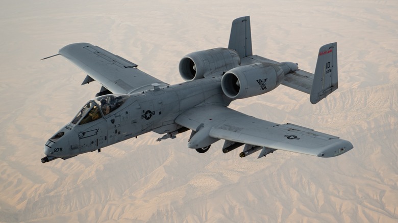A-10c Thunderbolt II flying over a desert.