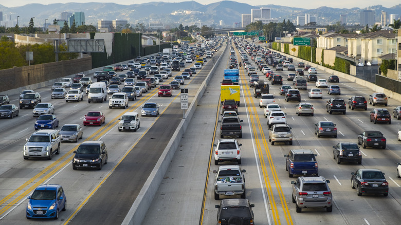 Overhead view of 12-lane highway of Los Angeles, California during evening rush hour