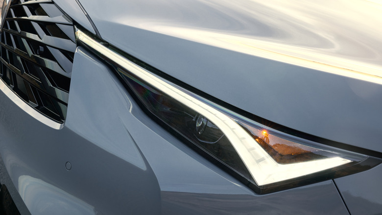 Close-up of the front-left headlight of an Acura ADX