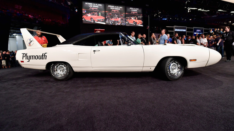 A white Plymouth Superbird is auctioned
