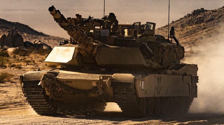 An M1A2 SEPv3 driving through the desert at the National Training Center