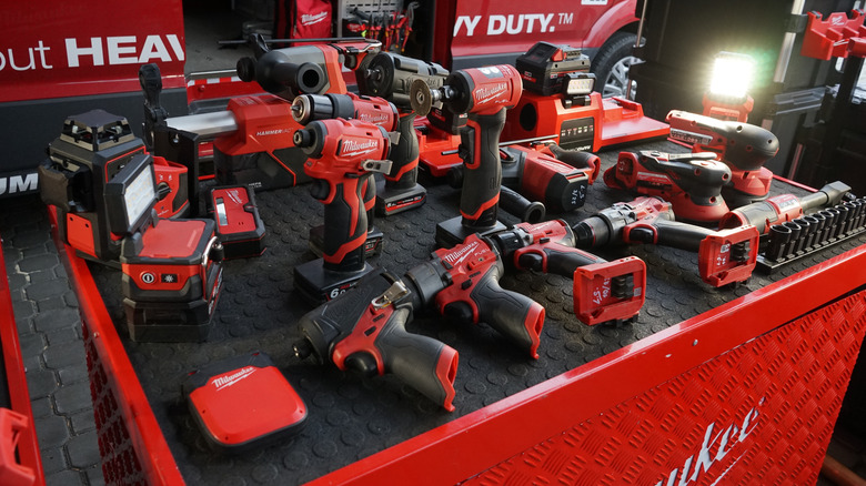 Various Milwaukee tools on a table.