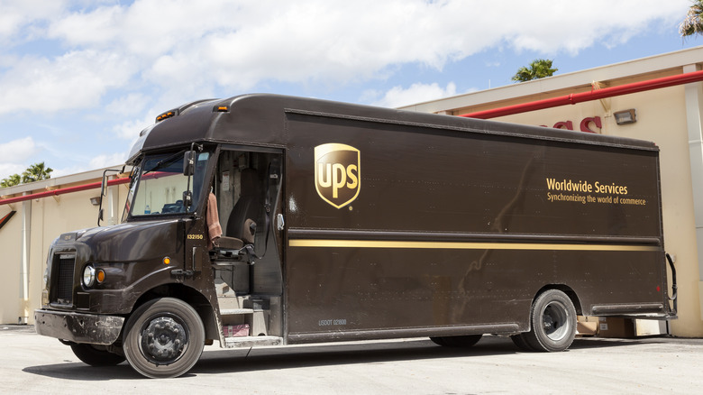 Front 3/4 view of UPS delivery truck in warehouse setting