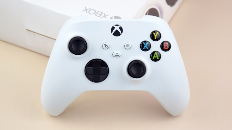 A white Xbox controller resting on a box.