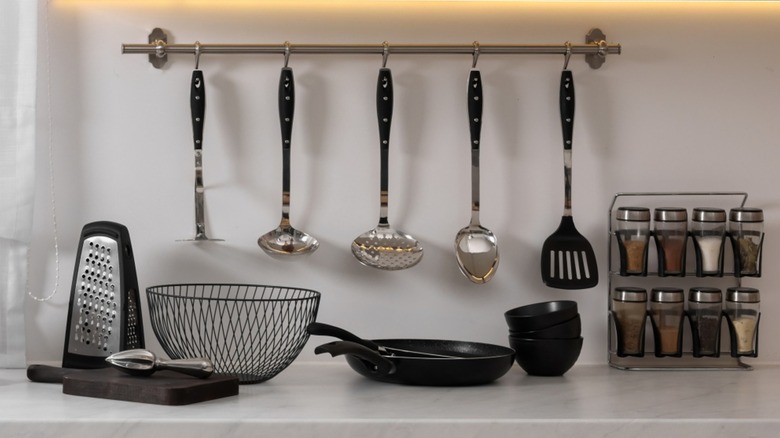 a kitchen counter with small kitchen gadgets on it