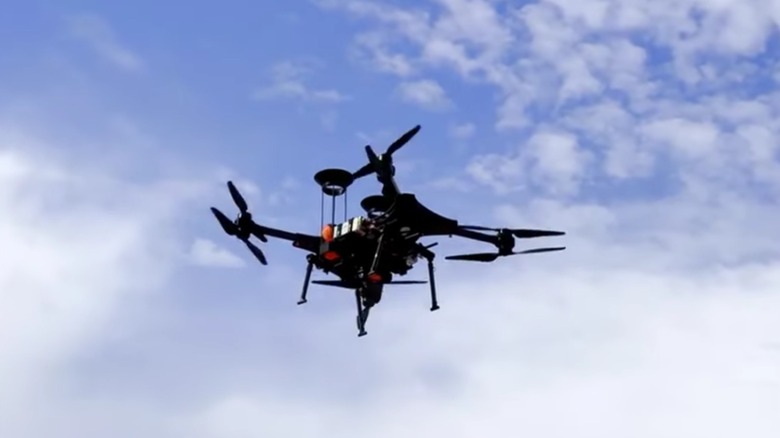 Close-up of flying drone from beneath.