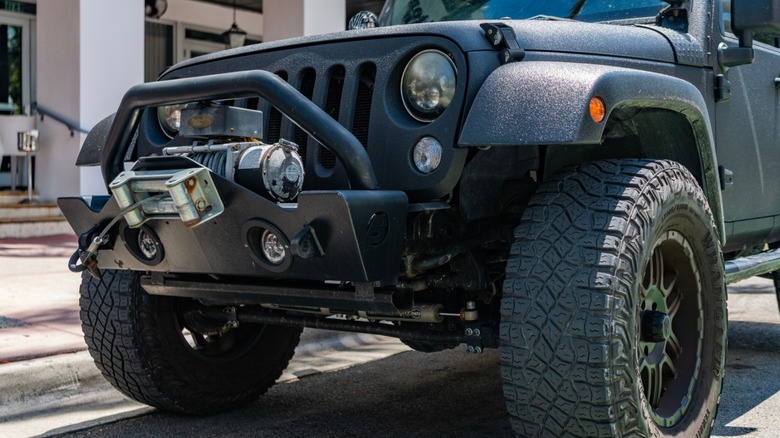 a Jeep Wrangler with a winch and steel bumper