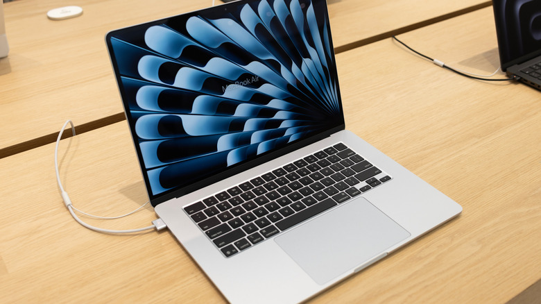 An open MacBook Air on display at an Apple Store