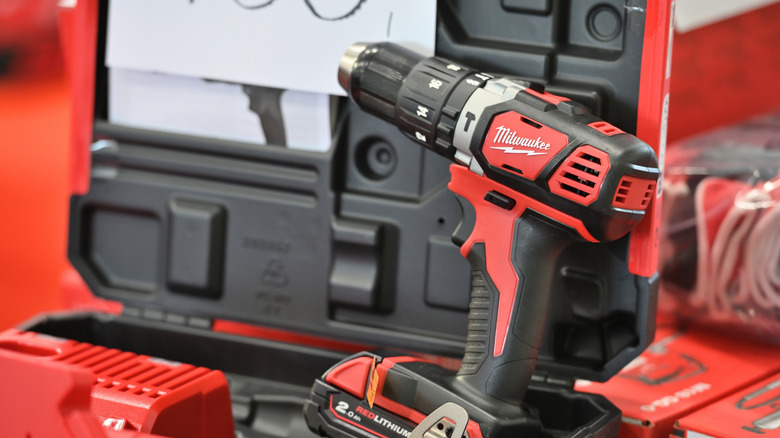 A Milwaukee drill on a stack of other boxed Milwaukee tools