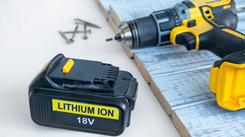 Power tool sitting beside an 18V lithium-ion battery