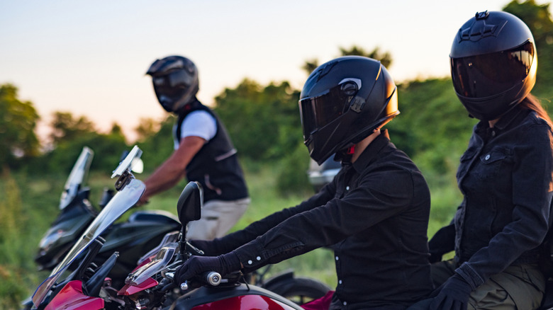 A group of three motorcycle riders.